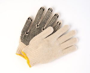 Poly/cotton string-knit gloves with palm dots, natural finish, economy liner
