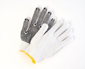 Bleached white poly/cotton string-knit gloves with palm dots, economy liner